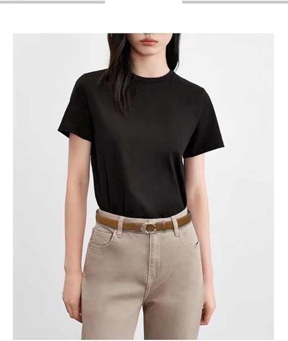 Person wearing a black t-shirt and beige pants on a white background