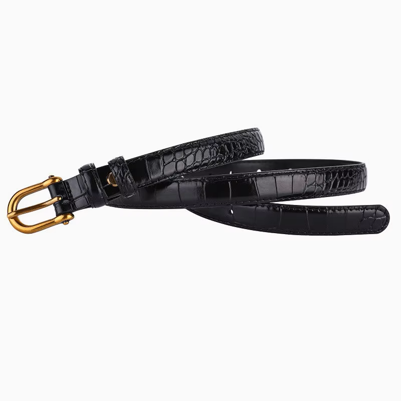 Black crocodile-patterned belt with a gold buckle on a white background